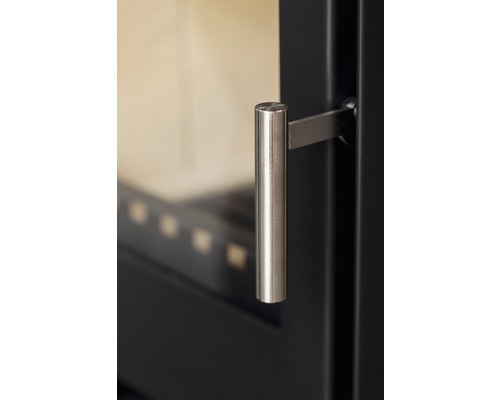 Detaljbild av en kamin med handtag