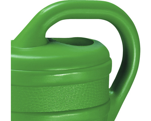 Detalj av en grön vattenkanna med handtag