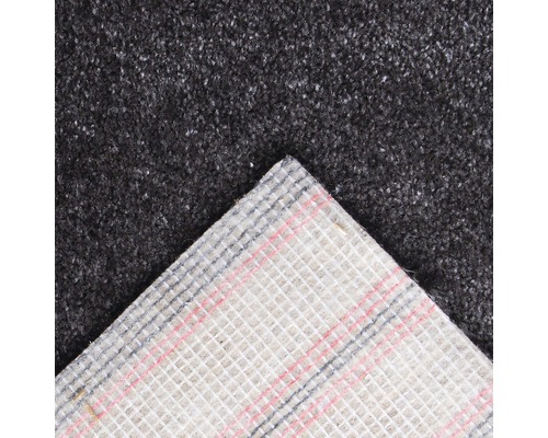 Detaljvy av en grå textilplatta med textilbaksida