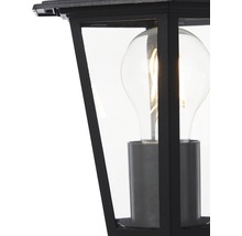 Detaljvy av en svart utomhuslampa med klar glödlampa