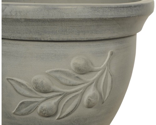 Närbild av en blomkruka med olivkvistmotiv