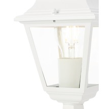 Detaljvy av en vit utomhuslampa med glödlampa.