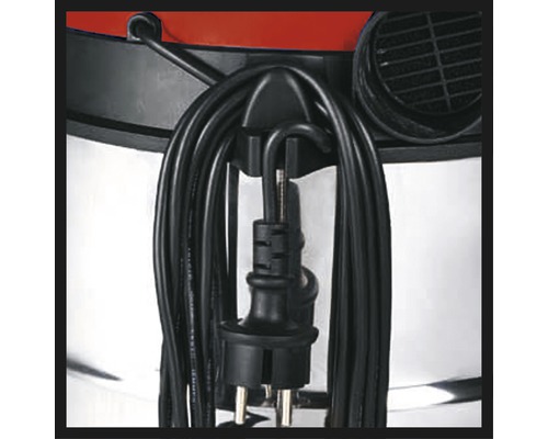 Detaljvy av dammsugare med upprullad sladd och kontakt