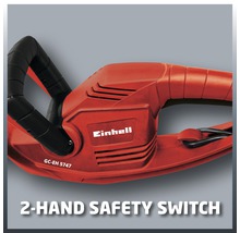 Einhell logotyp på en häcksax med tvåhands säkerhetsbrytare