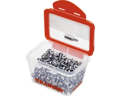 Skruvar i en genomskinlig plastlåda med skruvmejselbit