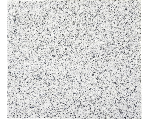 Närbild av en granitplatta med fläckig textur.