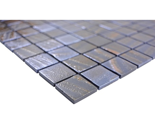 Mosaikplattor av metall