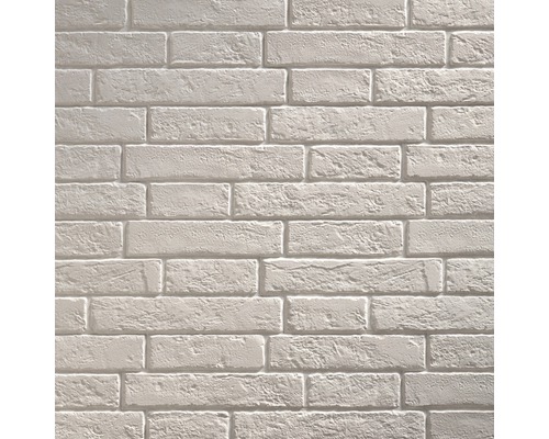 Ljus tegelvägg som bakgrund för byggprojekt