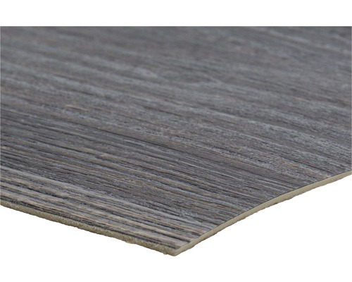 Detaljbild av en vinylgolvplatta med träutseende