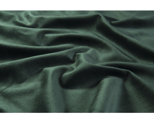 Närbild av mörkgrönt sammetstyg med veck