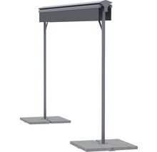 Fristående rökbås av metall på betongplattor