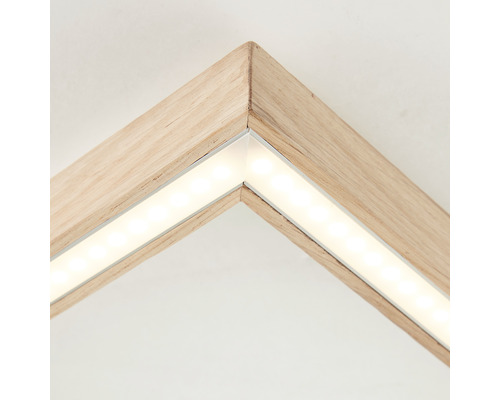 Detaljbild av en träram med LED-belysning