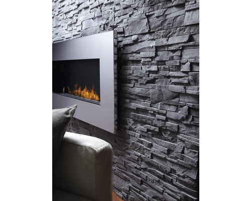 Vardagsrumsvägg med fasadtegel och öppen spis