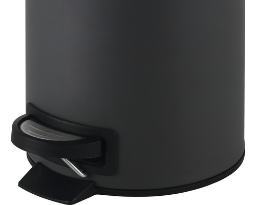 Detaljvy av en rund soptunna med pedal