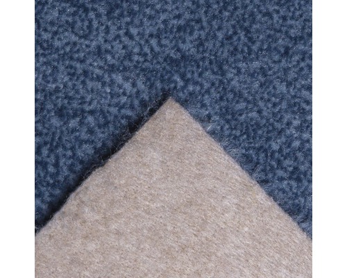 Detaljvy av en textil golvbeläggning med textilbaksida