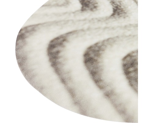 Detaljbild av en bordsyta med ett vågigt mönster