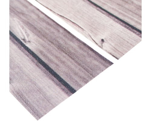 Närbild av självhäftande möbelfolie med trästruktur