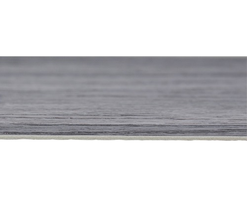 Detaljbild av ett grått vinylgolv med träutseende