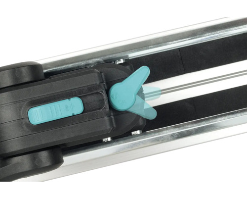 Detaljvy av kakelskärare med spak och skena