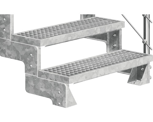 Detaljvy av en galvaniserad trappa med två steg.