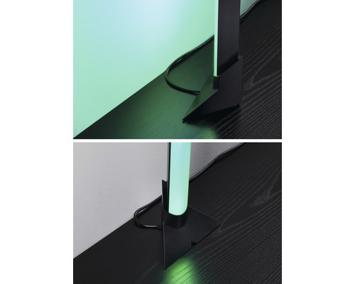 Detaljvy av en modern golvlampa med svart fot och sladd