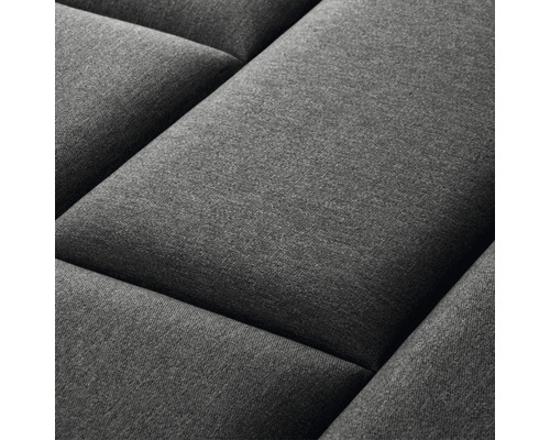 Närbild av en grå, vadderad väggpanel