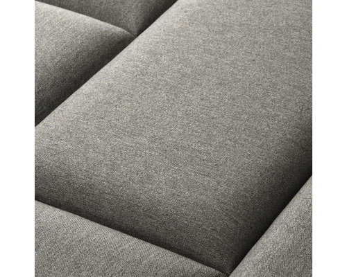 Närbild av en grå soffkudde.