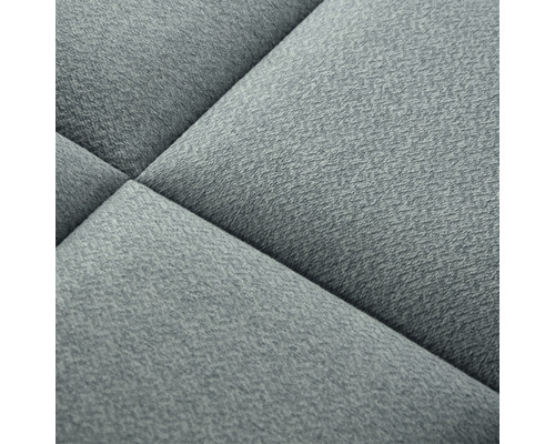 Närbild av en strukturerad, stoppad möbel