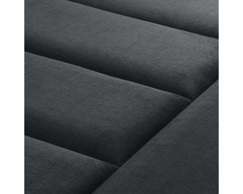 Närbild av en möbel med vadderad yta