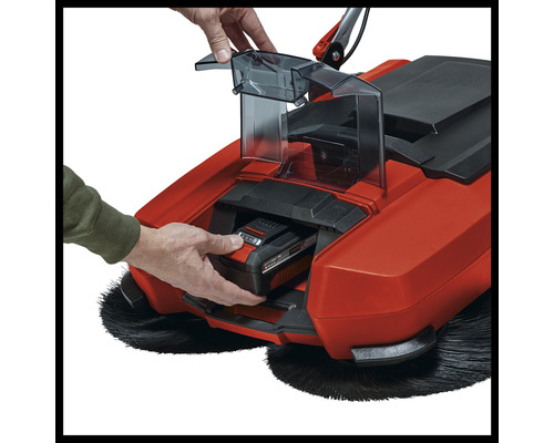 Sittande sopmaskin med insatt batteri