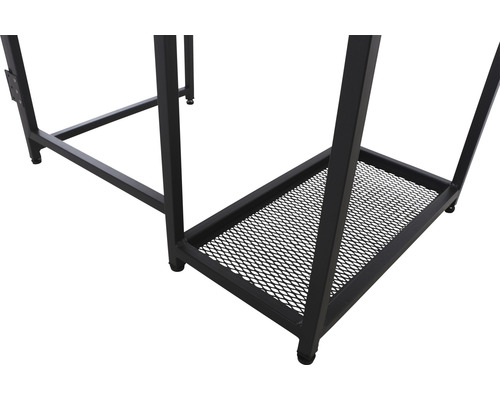 Detaljvy av ett skrivbord med svart metallram och förvaringsgaller.