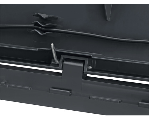 Detaljvy av öppningsmekanismen för en takbox