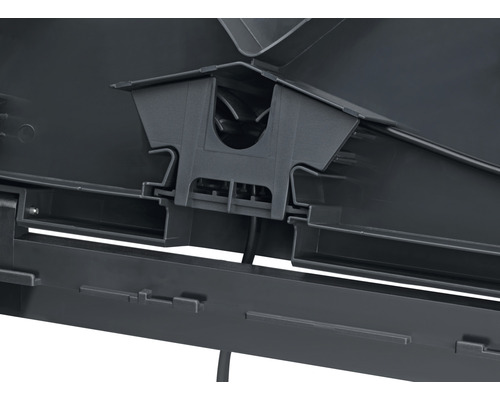 Detaljvy av en svart plastdel