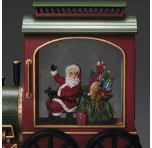 Jultåg med jultomte, presenter och teddybjörn