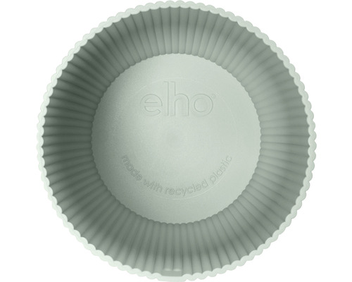 Ovanifrån ser man en rund blomkruka av återvunnen plast med vågig kant och Elho-logotyp.