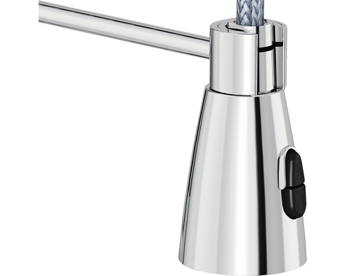 Detaljbild av en lampa med kromad yta och strömbrytare