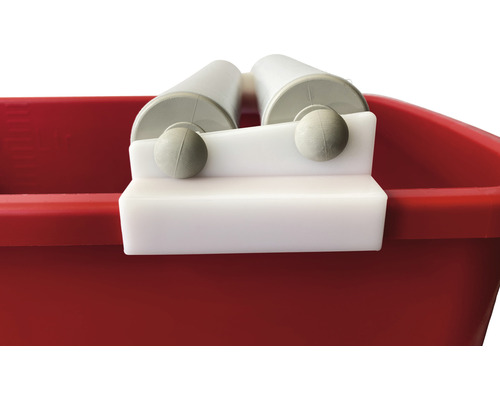 Utrustning för att trycka ut färgroller på färgburken