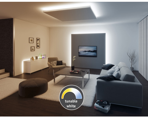 Vardagsrum med soffa, fåtölj och LED-belysning med justerbar färgtemperatur