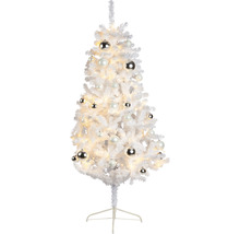 Vit julgran med dekorationer och ljus