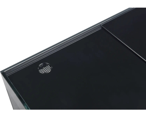 Detaljvy av ett akvarium med svart lock och ventilationsöppning