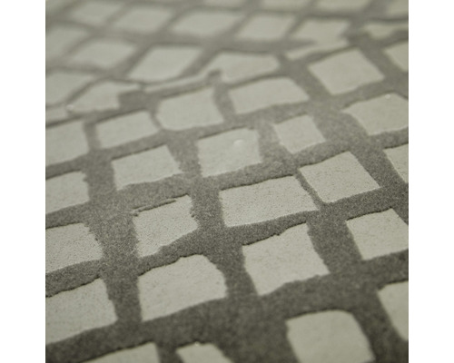 Närbild av en matta med ett kvadratiskt mönster