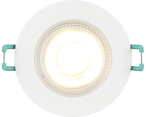 Rund LED downlight med vit ram och tänd varmvit belysning.