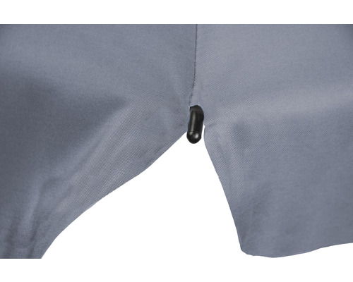 Detaljvy av ett tyg med en öljet