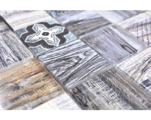 Mosaikplatta med trädesign och blommönster