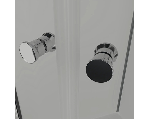 Detaljbild av två dörrknoppar på en duschkabin