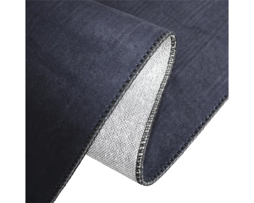 Detaljvy av en matta med vikt kant