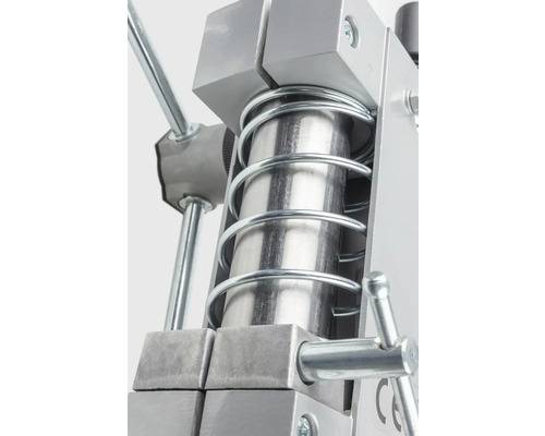 Detaljvy av en metallpress med fjäder