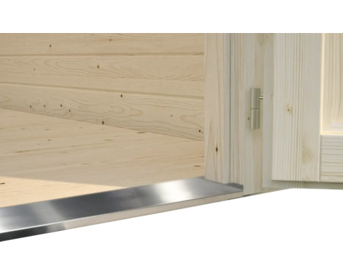 Detaljvy av ett lusthus med trävägg, trägolv och metallkant