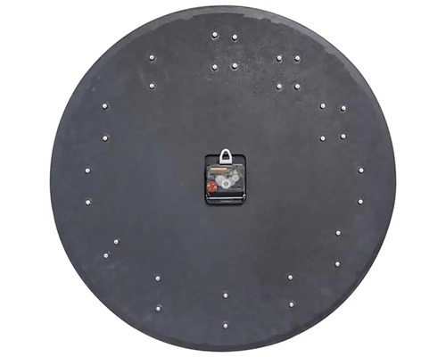 Baksidan av en rund väggklocka med urverk