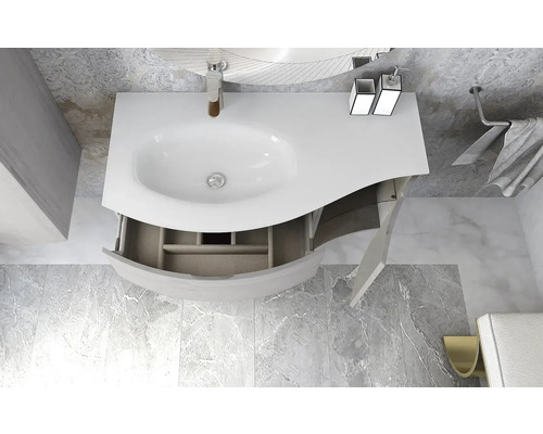 Tvättställ med öppet underskåp och armaturer i ett badrum